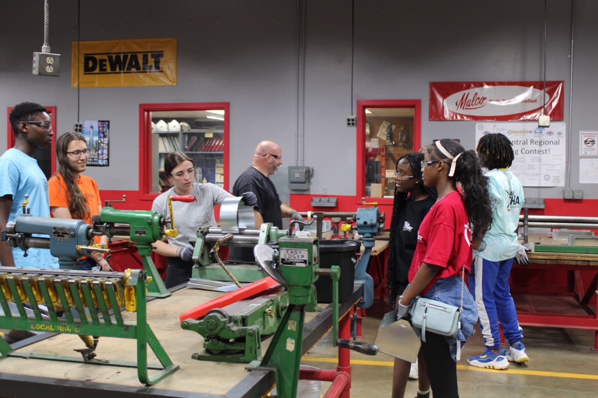 All THAT youth learning trades in a workshop